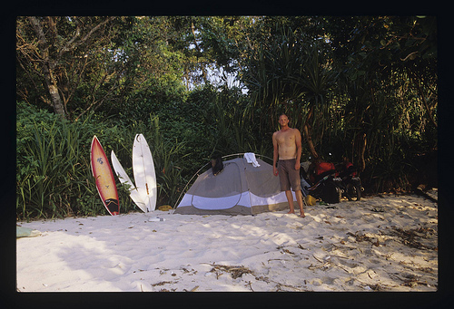 Ed camping out in Indonesia with his FCD Octo surfboard at the ready