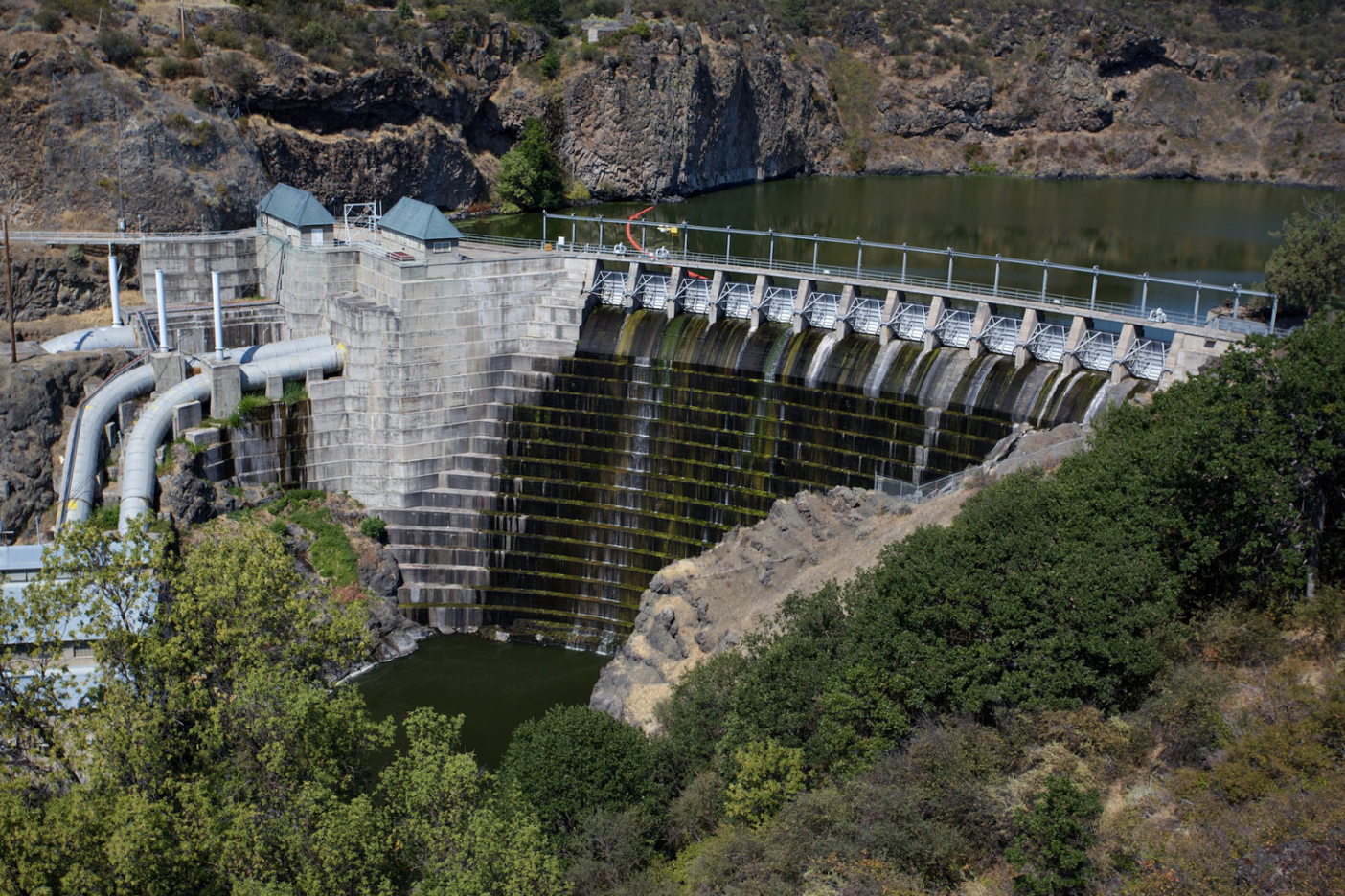Copco #1 Dam, and three others in California and Oregon, are planned for removal from the Klamath River opening up hundreds of miles of spawning and rearing habitat, improving water quality, and negating the need and high costs associated with the Iron Gate Fish Hatchery below the lower dam. DamNation collection. Photo: Matt Stoecker