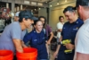 We believe that bringing a clean water solution is vital to areas in need. Here, Otto shows some Coast Guard officers how to implement the filtration systems. Photo: Ethan Lovell