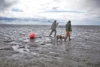 Ryan Peterson and Mike Wood head out to their set net site at the mouth of the Susitna River, Alaska. Photo: Travis Rummel