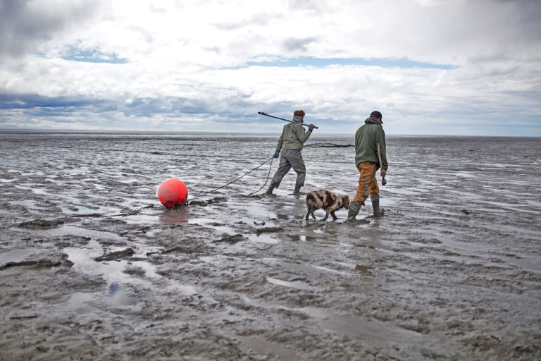 Ryan Peterson and Mike Wood head out to their set net site at the mouth of the Susitna River, Alaska. Photo: Travis Rummel