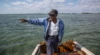 Ansil Saunders points to the mangrove island, still visible today, where the all-tackle world-record bonefish was landed. Photo: Brian Irwin
