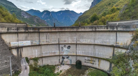 Built in 1959, the Idbar Dam cracked soon after its construction. Investors and construction crews had ignored multiple warnings from the locals not to underestimate the force of the Bašćica, a river known to be unpredictable and fast-flowing. Idbar was decommissioned soon after it was constructed, when the river began fracturing the dam, allowing the Bašćica to flow freely again. Konjic, Bosnia and Herzegovina. Photo: Andrew Burr