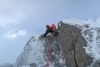 Kelly Cordes scraping away the white on Jenga Buttress, Creagan Cha-no, Cairn Gorm. Photo: Simon Richardson