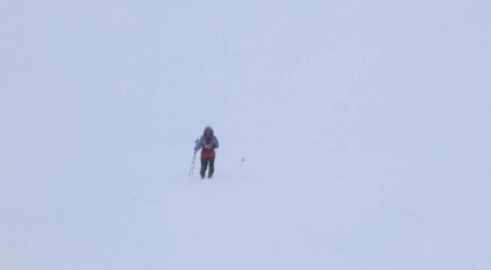 Simon navigating toward the block of rock atop the Cairn Gorm plateau. Photo: Kelly Cordes