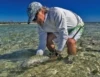 Dr. Aaron Adams releases a bonefish, the gray ghost of the flats. Grand Bahama Island. Photo: Justin Lewis