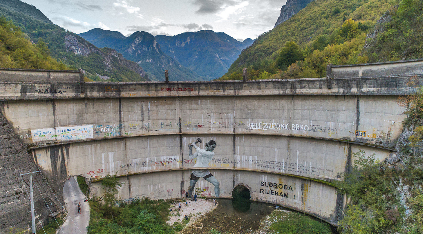Built in 1959, the Idbar Dam cracked soon after its construction. Investors and construction crews had ignored multiple warnings from the locals not to underestimate the force of the Bašćica, a river known to be unpredictable and fast-flowing. Idbar was decommissioned soon after it was constructed, when the river began fracturing the dam, allowing the Bašćica to flow freely again. Konjic, Bosnia and Herzegovina. Photo: Andrew Burr