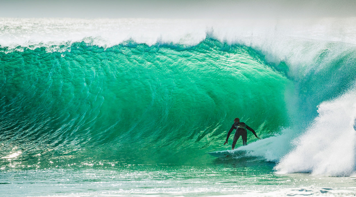 In front of a jump-off rock aptly named Life and Death, Dan Ross puts a new 5'9