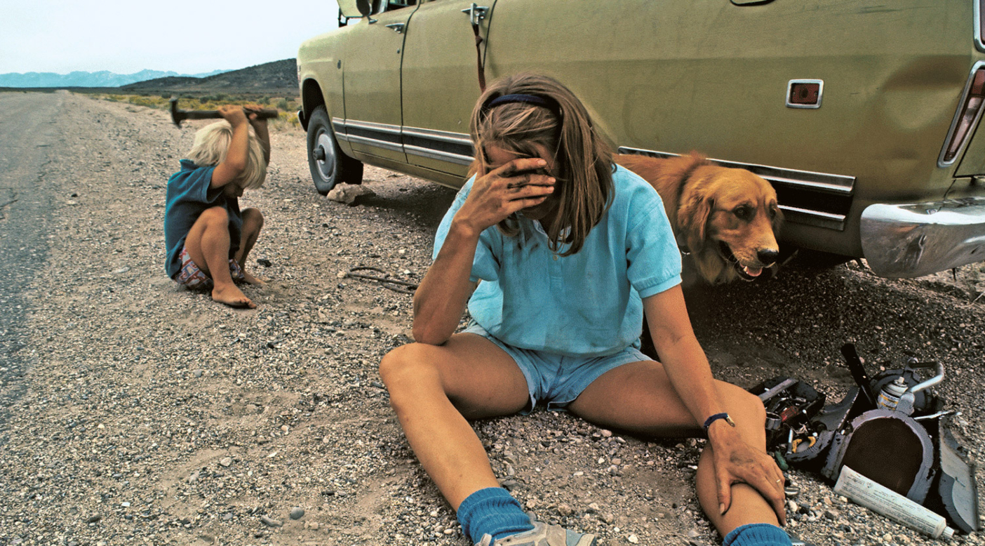 The last straw. Meredith Wiltsie wiring the damn muffler en route to the Ruby Mountains, Nevada. Photo: Gordon Wiltsie