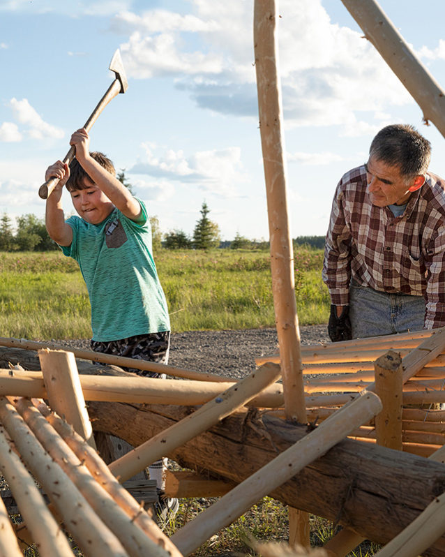 Getting an early education into traditional ways. Nine-year-old Cannon Cadzow helps his grandfather Earl build a fish wheel for salmon season. Photo: Keri Oberly