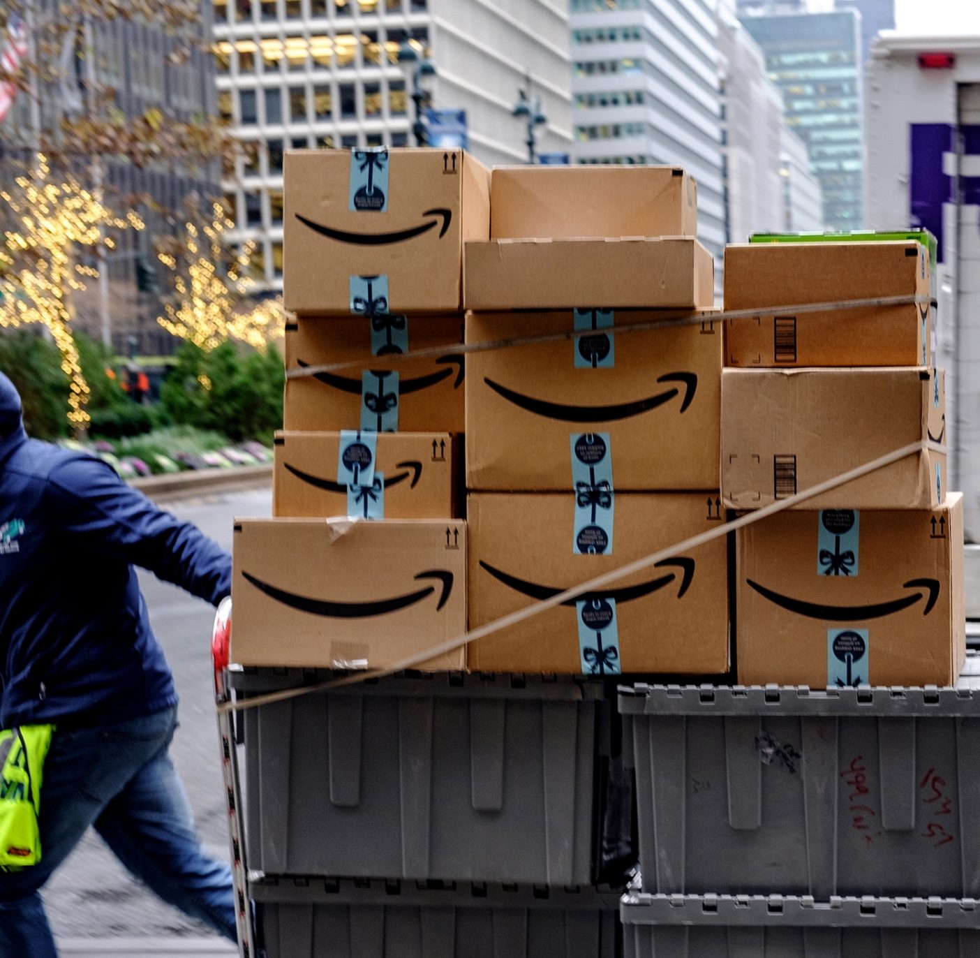 Our goal to get to net zero is just the first step and we eventually want to be in a place where we rely less on offsets and see our emissions drop towards zero. To do this, we need business and customers to join the movement. A worker pushes packages in New York. Photo: Christopher Lee/Getty Images