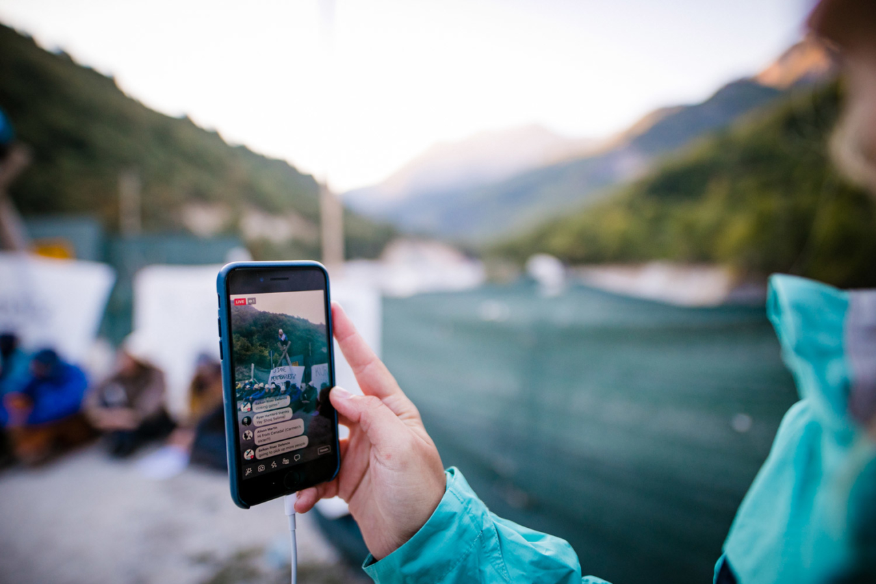 Going live for the world to see. We blocked the gate to an illegal building site of a dam project in Valbona Valley, Albania, during the third Balkan Rivers Tour in September 2018. Photo: Katja Jemec