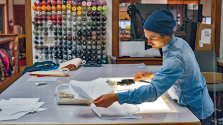 Designer Eric Noll reviews patterns for trail running gear. Photo: Kyle Sparks