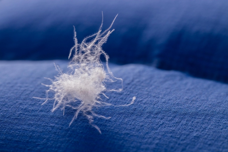 A down cluster sits on blue shell fabric - down fill power unknown.